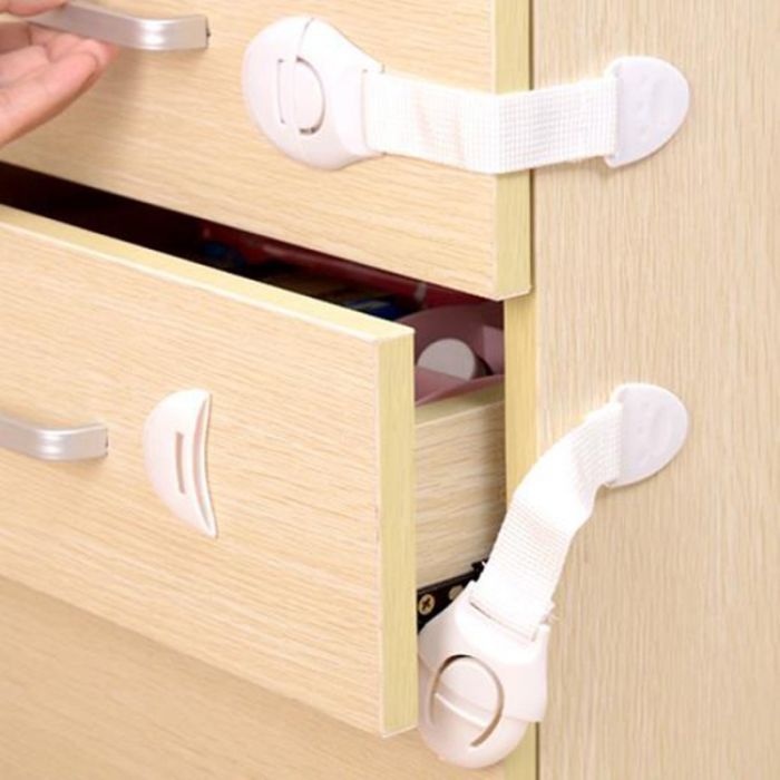 Door and drawer lock with protective fabric