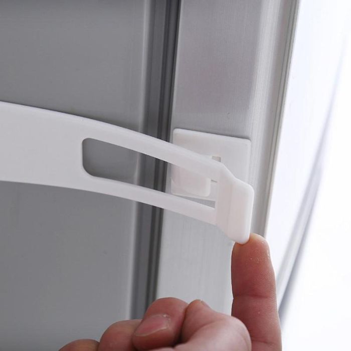 Plastic door latch lock with adhesive backing