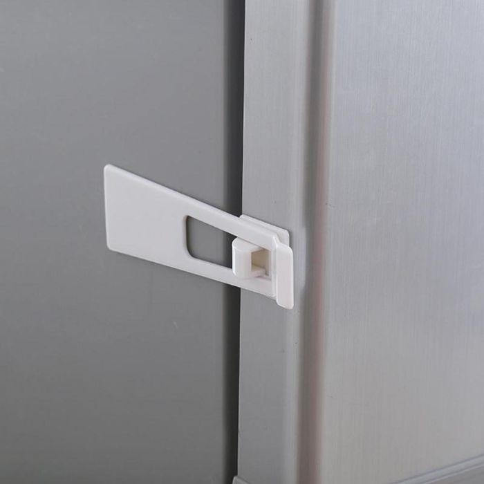 Plastic door latch lock with adhesive backing