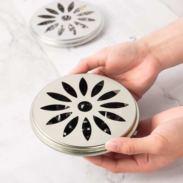 Mosquito coil holder with holes in the lid