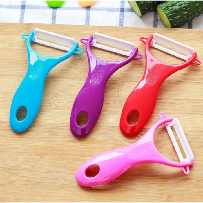 Ceramic vegetable peeler with plastic handle