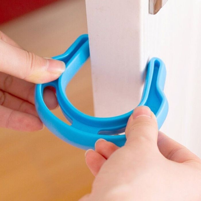 Plastic reinforced horseshoe shaped doorstop