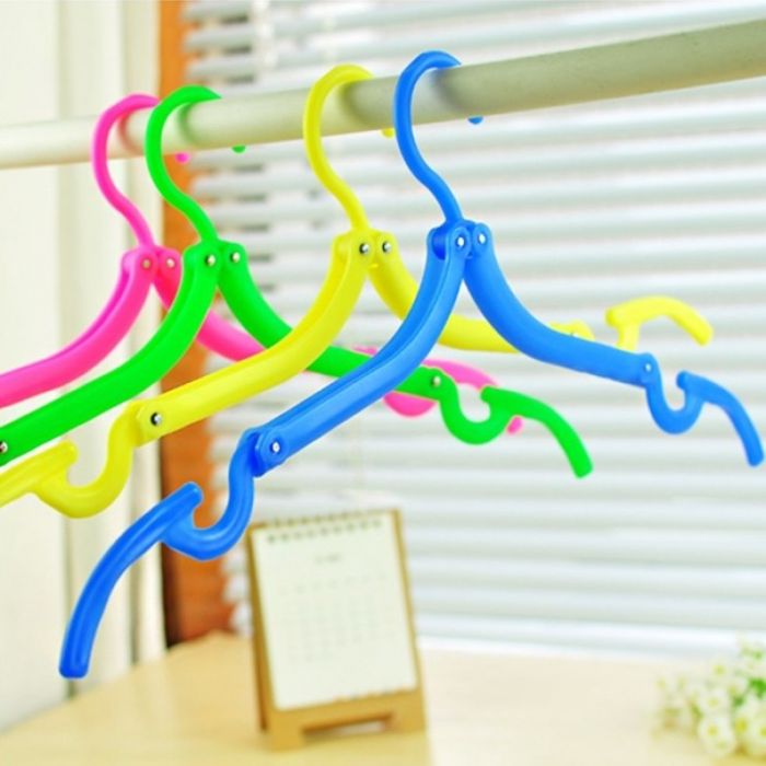 Folding plastic hangers for clothes